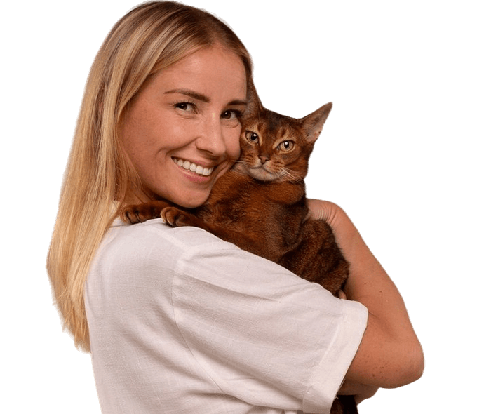 smiling woman hugging cat